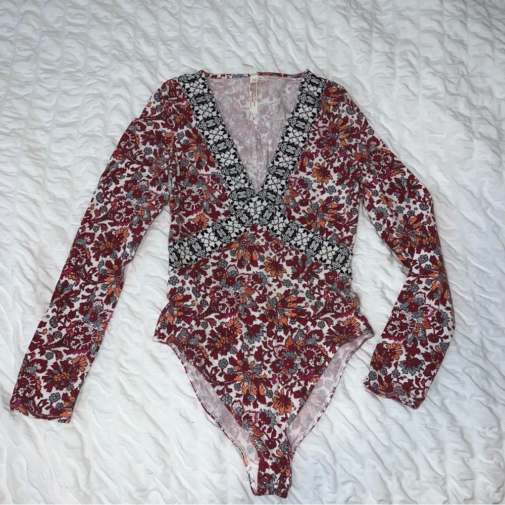 Free People bodysuit , multi colored design , xs